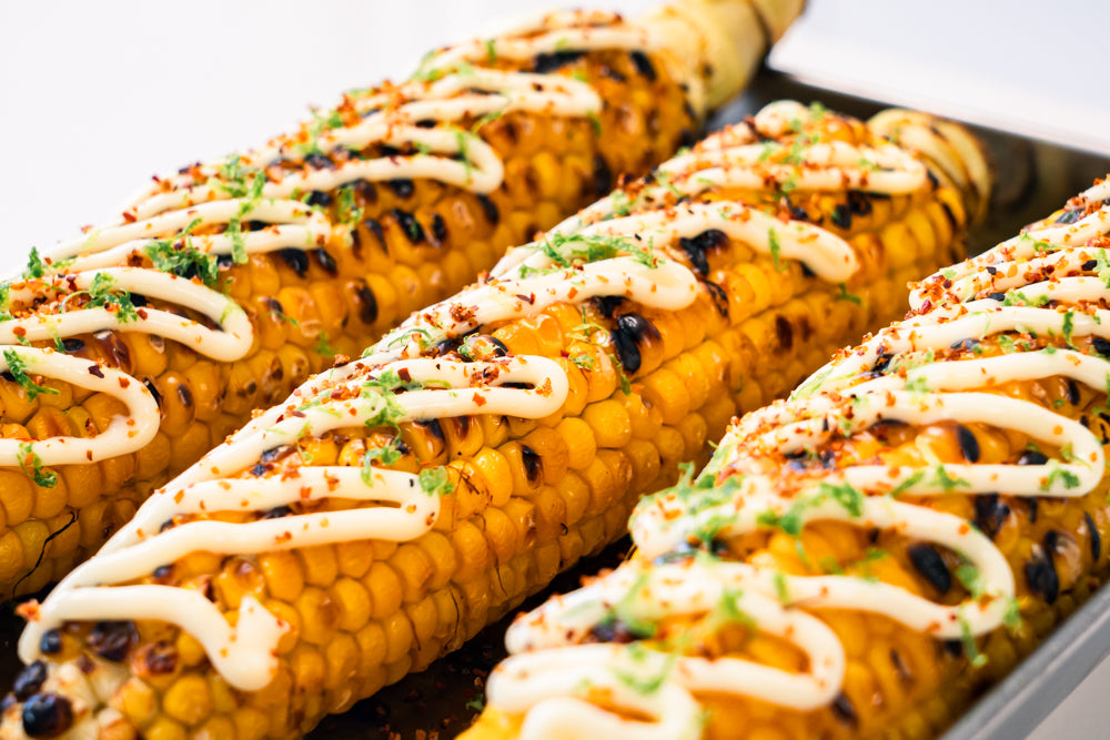 Grilled corn with mayo, lime and tajin
&ndash; Andy Cooks