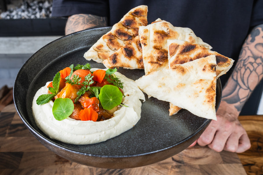 Grilled flatbread, whipped feta and blistered tomatoes